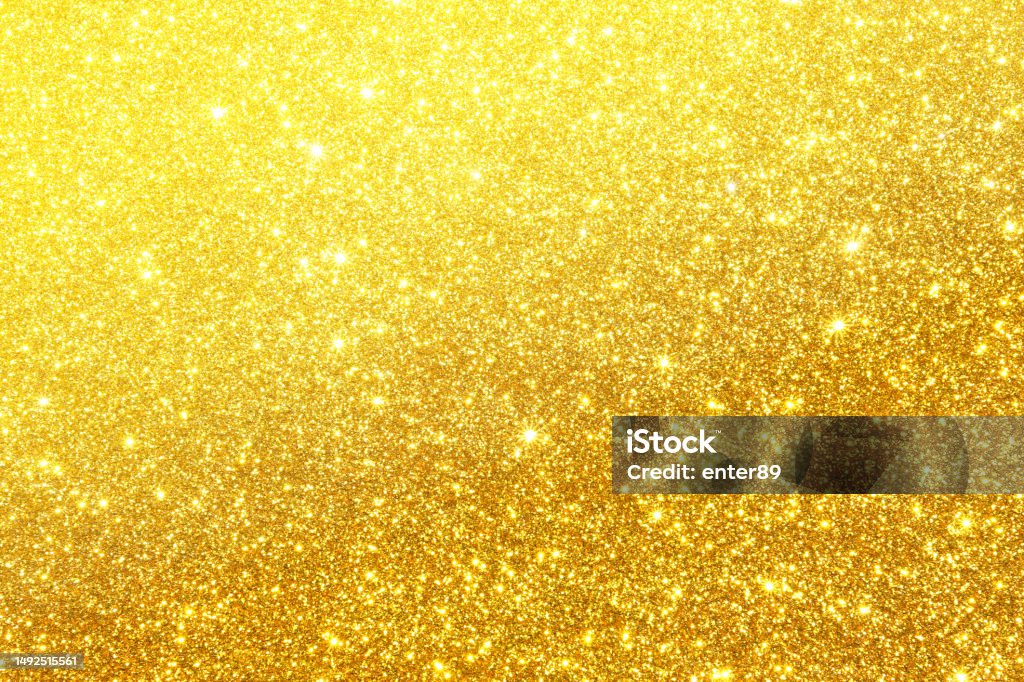 Golden glitter Golden glitter texture background Vibrant Color Stock Photo