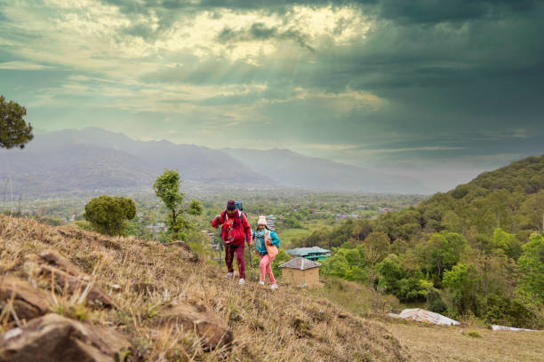 istock Happy couple trekking on a mountain. 1492518050