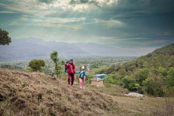 istock Happy couple trekking on a mountain. 1492518066