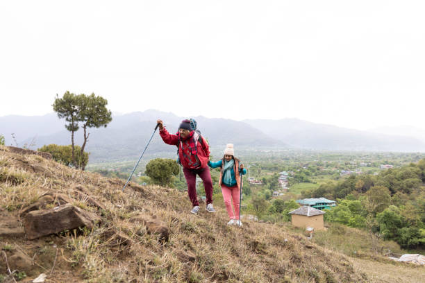 istock Happy couple trekking on a mountain. 1492518073