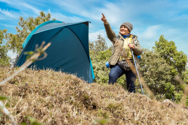 istock Elderly active woman on a leisure trip admiring the landscape. 1492518973