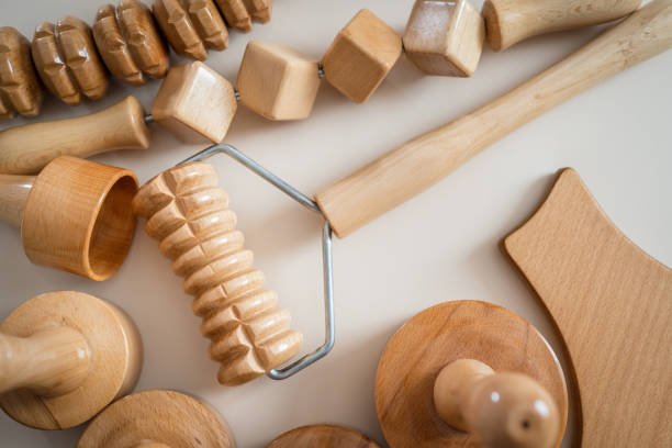 Wood massage maderotherapy madero therapy wooden rolling pin or battledore tools for anti cellulite treatment to stimulate the lymphatic system and improve circulation concept