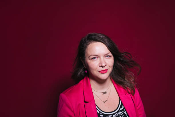 istock Female Brunette CEO Wearing Pink Blazer 1492521126