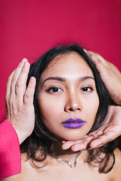 istock Beautiful Woman With Hands Holding Her Fave 1492521199