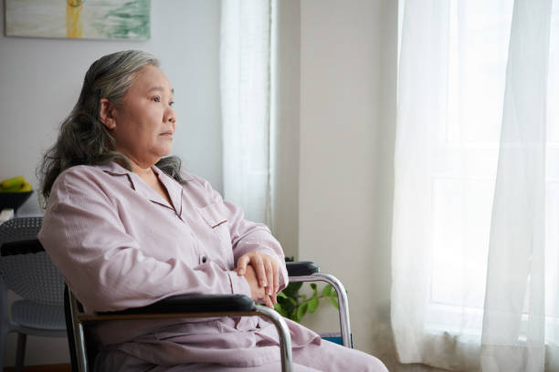 istock Lonely Senior Woman with Disability 1492525536
