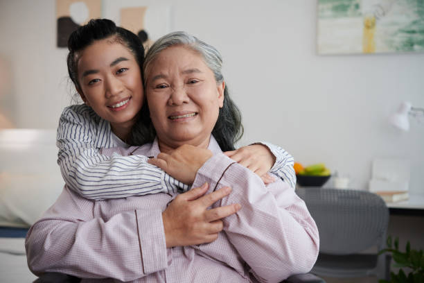 istock Joyful Woman Hugging Grandmother 1492525581