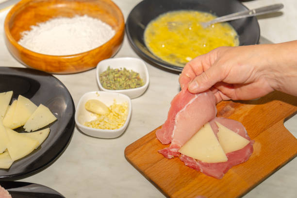 istock woman stuffed pork fillets with cheese 1492526972