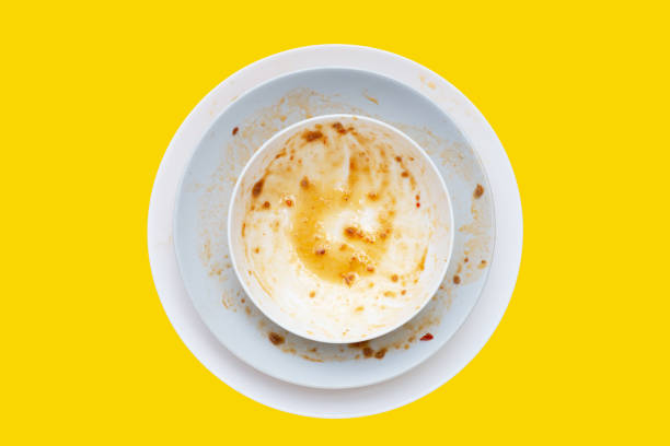 istock Dirty dishes on yellow background. Top view 1492528660