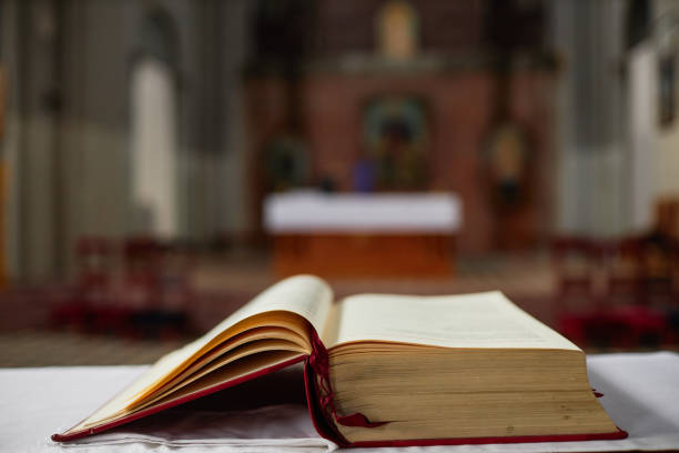 istock Bible book on table in church 1492532856