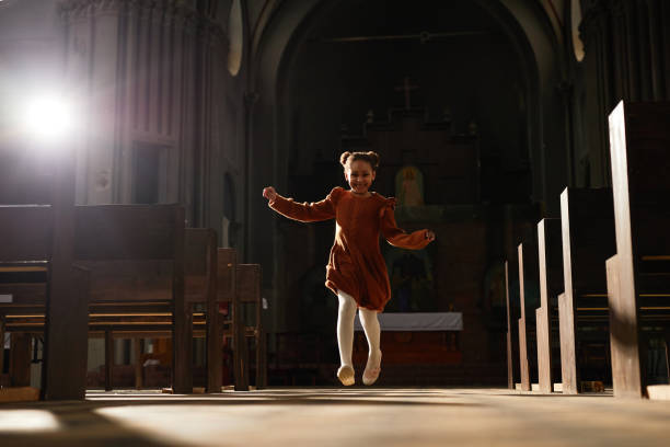 istock Little girl playing in old church 1492532861