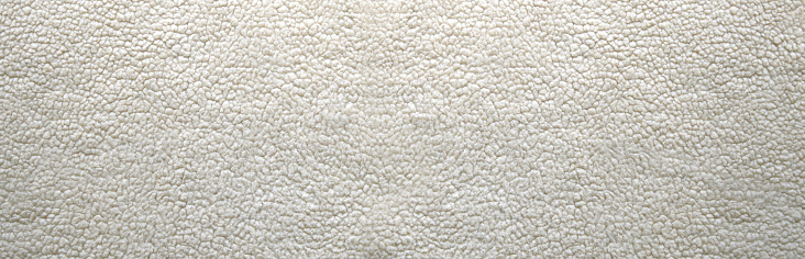 White wool texture. Abstract wool textured  backgrounds. Closeup beige wool banner.
