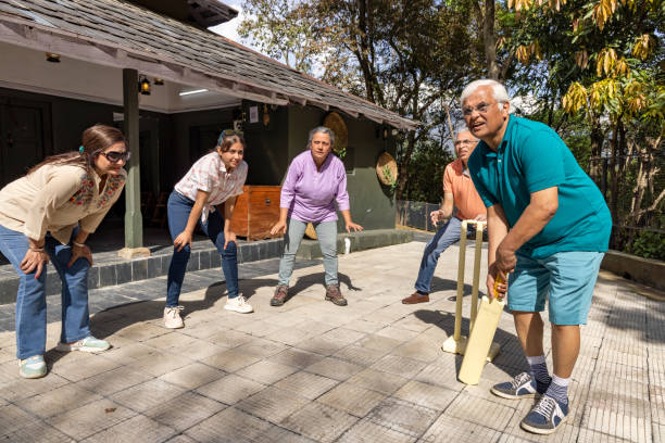 istock Family members playing cricket in the back yard. 1492535005