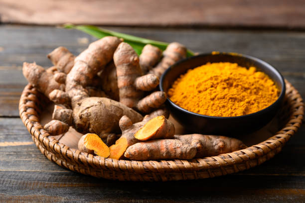 istock Turmeric powder and fresh turmeric (Curcuma, curcumin) 1492535585