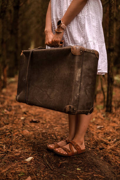 istock An old suitcase held by a woman 1492537516