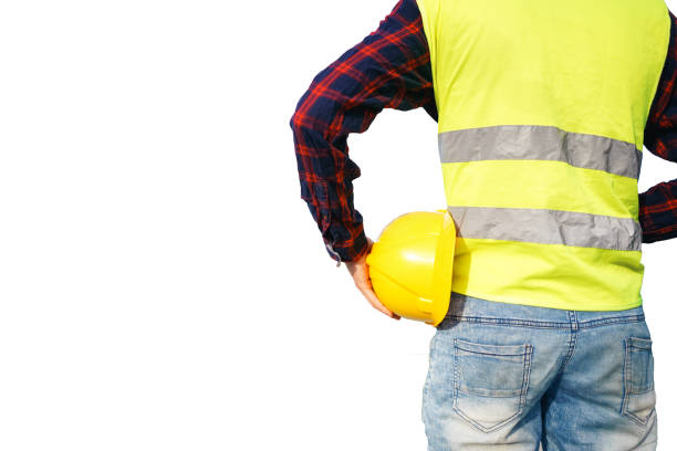 istock Construction worker holding yellow helmet. Building worker wearing fluorescent waistcoat. Isolated. 1492539121