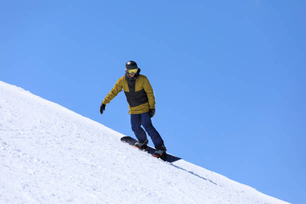 istock Snowboarding   Young man  snowboarder  on the mountain ski slope 1492539527