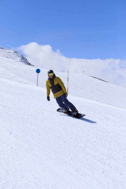istock Snowboarding   Young man  snowboarder  on the mountain ski slope 1492539583