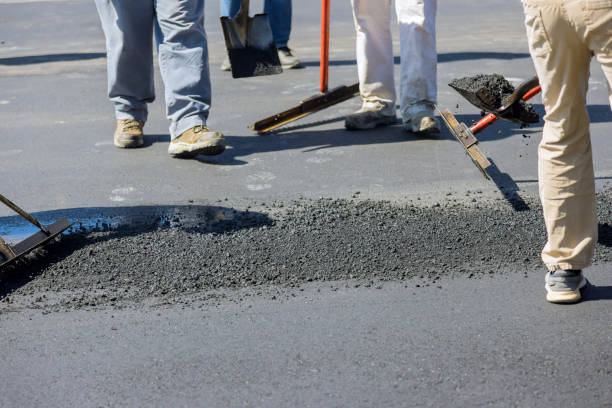 istock Construction worker laying new asphalt roads as part of a process of asphalting 1492543973