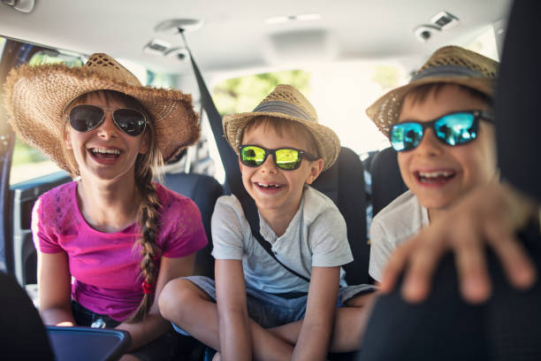 istock Kids enjoying road trip on sunny day 1492543994