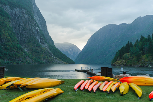 Group of colourful kayaks on the background of the fjord in Norway