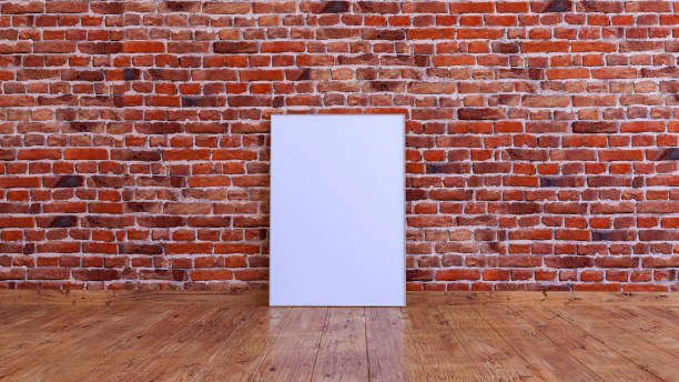 istock Vertical frame mockup on a red brick wall with wooden floor. 1492549992