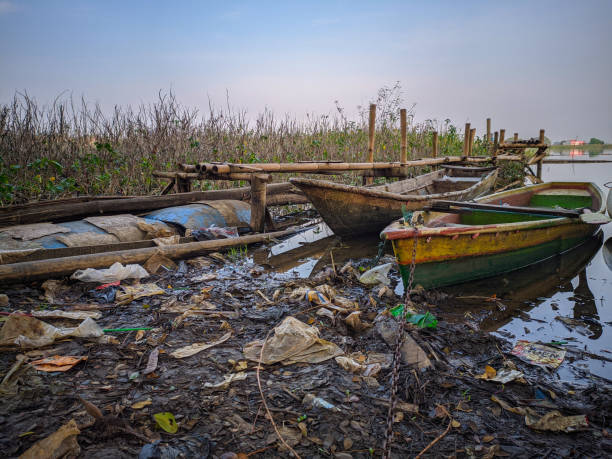 istock Trash and wooden boat 1492550223