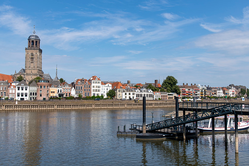 Panoramic view over the IJssel river towards the medieval city of Deventer, the Netherlands with in the middle the mains church of the city, the Great Church or St. Lebuinus Church
