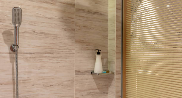 istock Bathroom with blinds and shower gel and shower head 1492550394