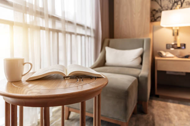 istock coffee and book on round table in empty room 1492550536
