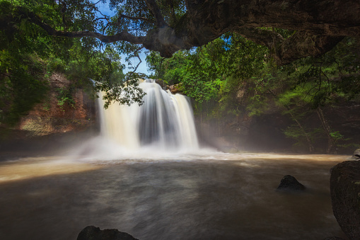 Beautiful waterfall with sunlight shining into the forest, Heo Suwat waterfall, Khao Yai National Park, Nakhon Ratchasima, Thailand