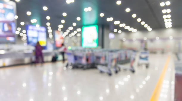 Blurred photo of waiting baggage hall at airport Blurred photo of waiting baggage hall at airport 機場離境區 stock pictures, royalty-free photos & images