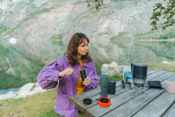 istock Woman brewing coffee in nature 1492552533