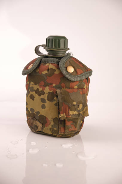 istock flask plastic army green not new in a camouflage cover on a white background with reflection 1492553512