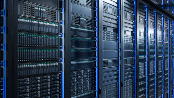 istock Server Racks and Cabinets full of Hard Drives inside Large Data Center. Advanced Cloud Computing Concept. 1492553614