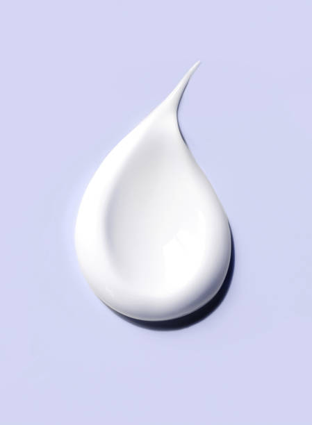 istock cosmetic smears cream texture on pastel purple background 1492553816
