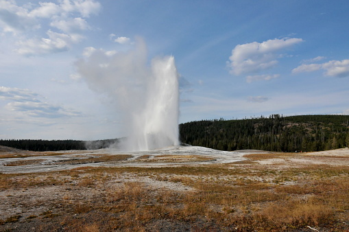 Utah, USA-September 10, 2011: The Yellow Stone National Park is one of the Natrual Wonders in the world. Here is the beautiful scenery of the Old Faithful Geyser in the National Park.