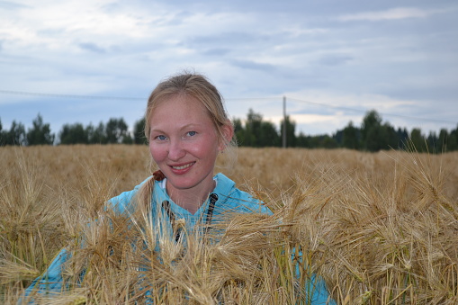 young woman in a wheat field