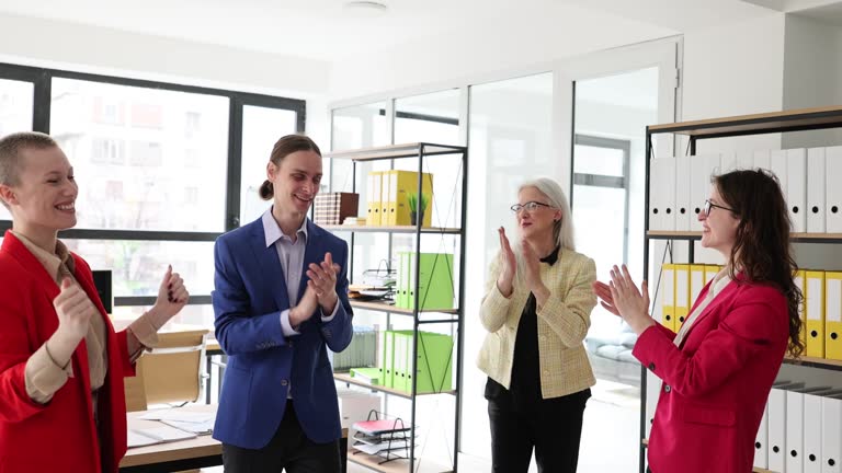 Positive colleagues throw papers up after finishing project