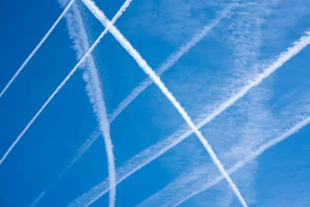 Cloudscape showing trailsl left by airplanes ft by aircraft or with the name of chemtrails.