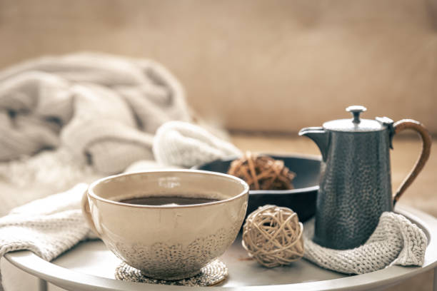 istock Home composition with a cup of tea and a teapot on a blurred background. 1492561530