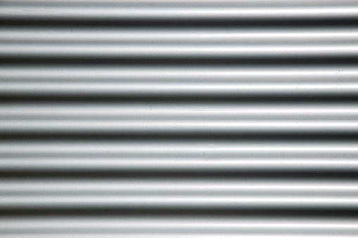 Close-up of the galvanized metal facade of a factory.