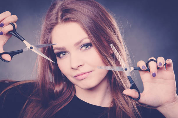 istock Professional elegant female barber with scissors. 1492561809