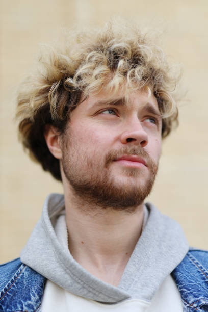 istock Portrait of focused bearded curly-haired man. 1492564403