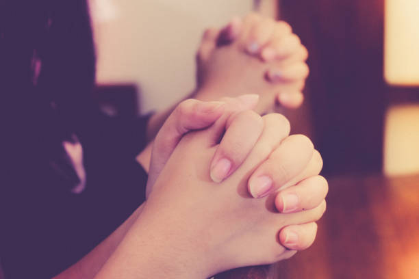 istock Human hand praying together at Church. 1492564547