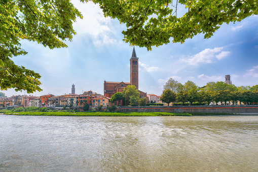 Amazing Verona cityscape view on the riverside with historical buildings and towers. Location: Verona, Veneto region, Italy, Europe