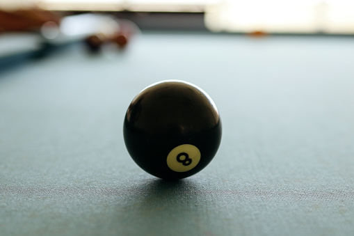 black ball on a pool table