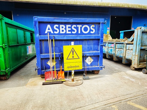 A skip with the word 'asbestos' emblazoned on it at the recycling centre.