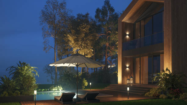 istock Modern Wooden Villa With Pool At Night 1492574163