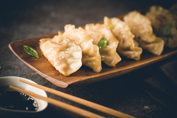 istock Asian dumplings with soy sauce 1492575849