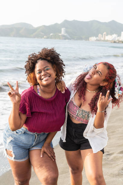 istock Happy Girls Having Fun On Beach 1492577344